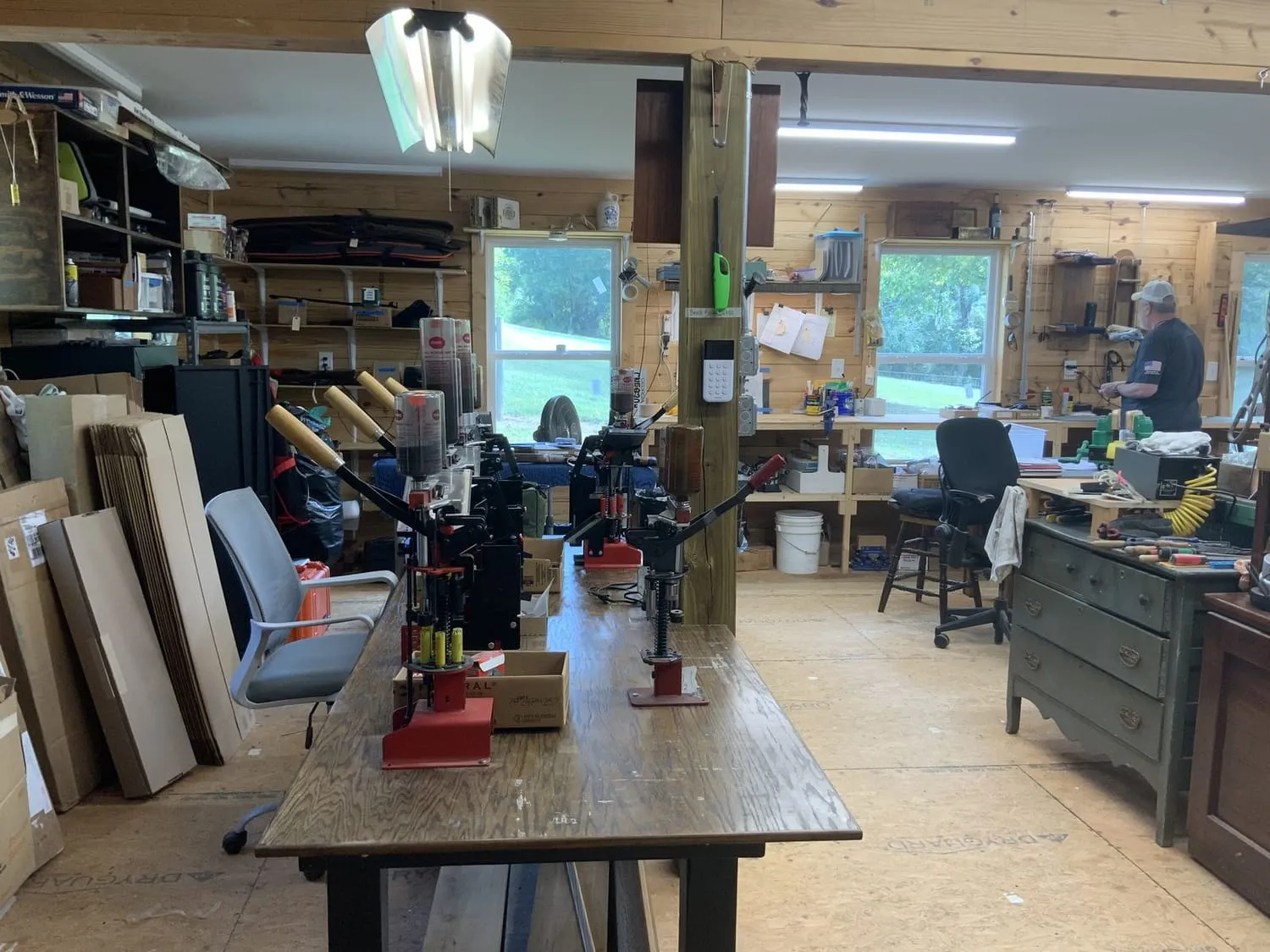 Walnut blanks stacked on end beside the duplicating bench